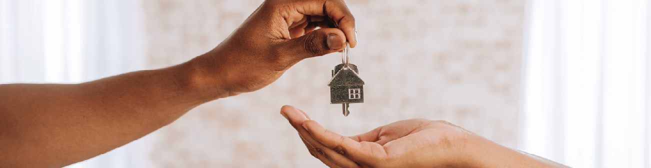 Handing keys to new homeowner