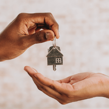 Handing keys to new homeowner